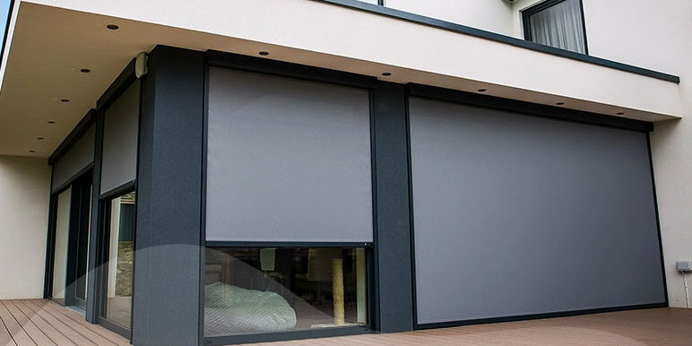 Two sets of outdoor blinds blocking out sunlight from living room